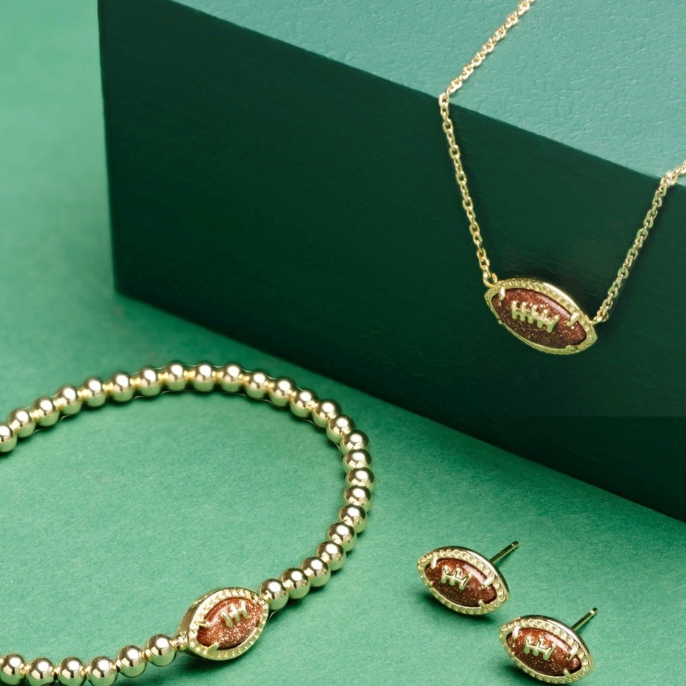 Kendra Scott gold-tone football collection, never worn.